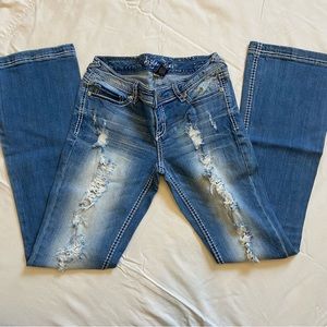 Ariya Jeans Low Rise Ripped Flared Leg Light Wash Jeans